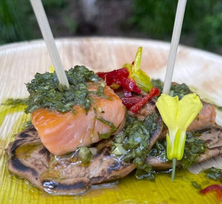 Seasonal fish dish with vegetables and wild flowers