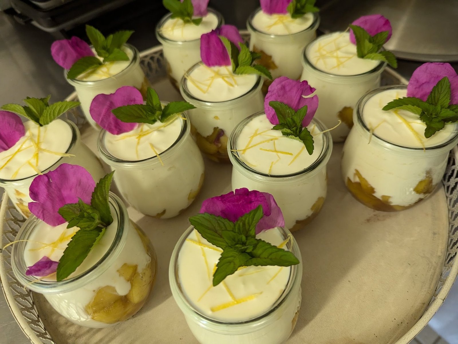 Freshly prepared individual desserts with flowers